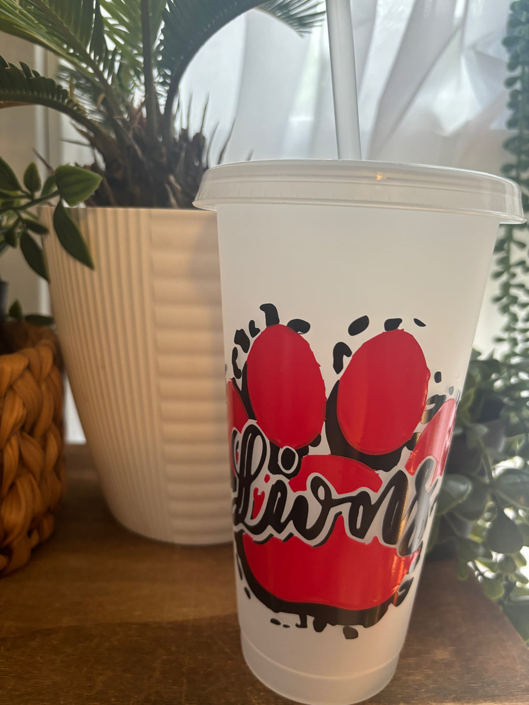 Lions cup with straw